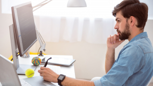 Man thinking in front of computer