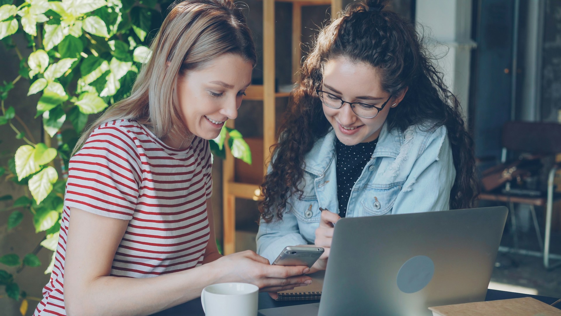 Two women looking at a computer