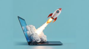 Rocket ship coming out of a laptop to represent growth